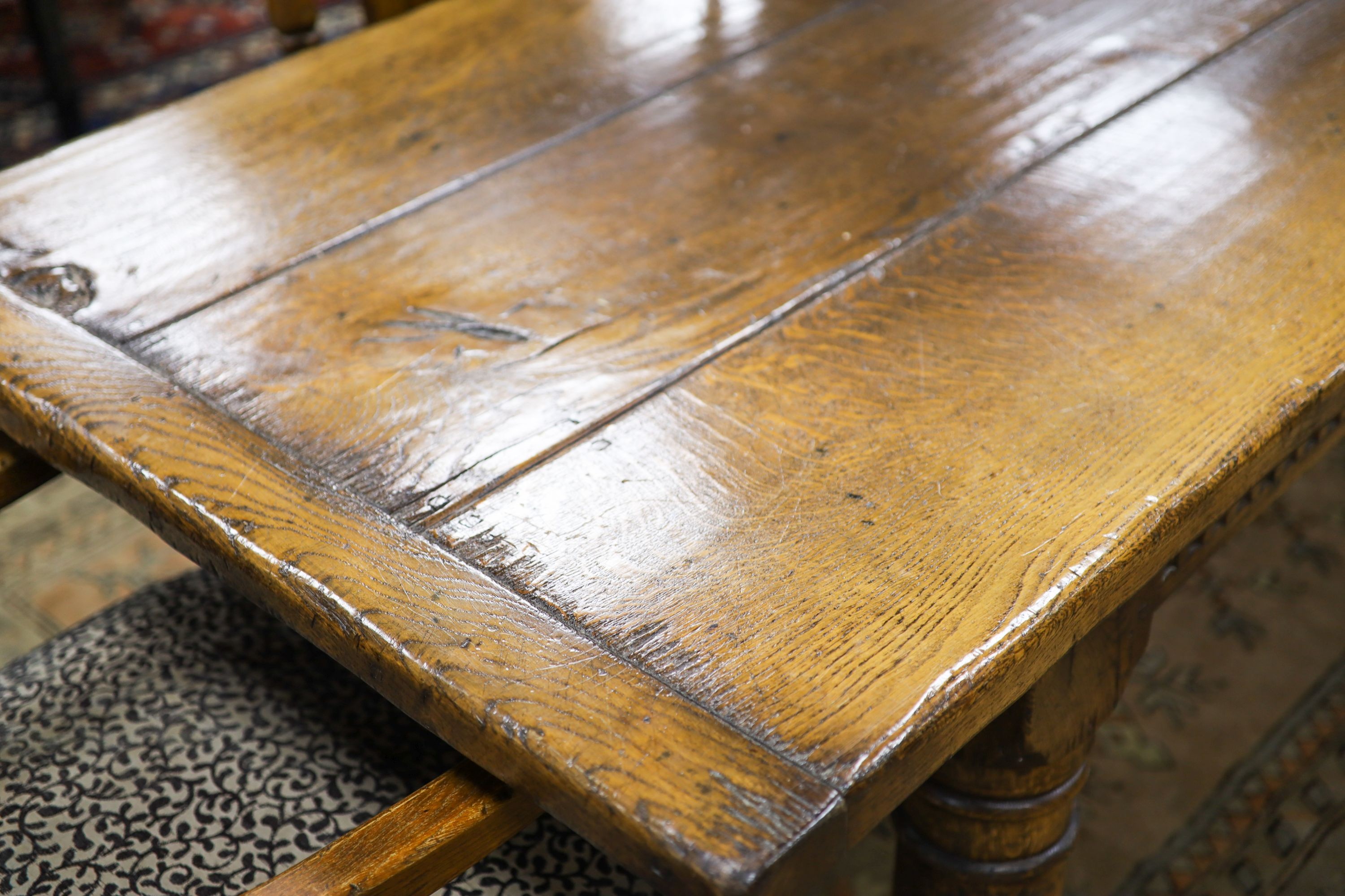 An 18th century style pale oak refectory dining table, length 305cm, depth 90cm, height 76cm